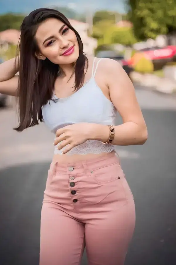 Pooja greater Noida call girls in white top and pink jeans